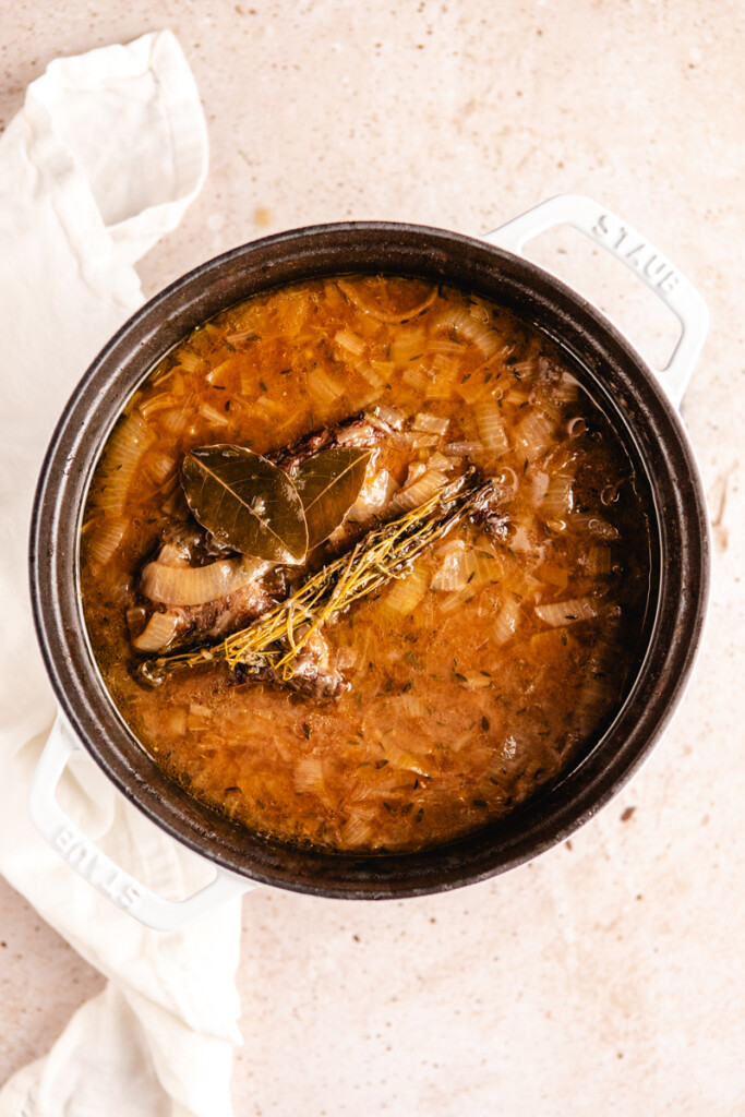 French Onion Soup with Braised Meat finished simmering in a dutch oven
