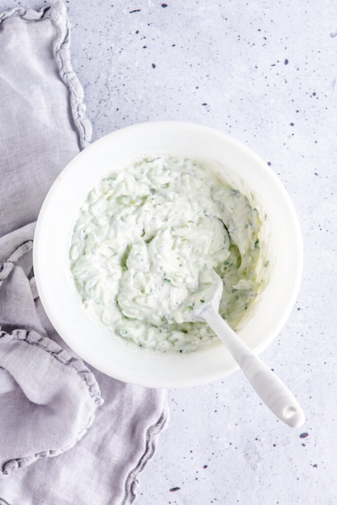 Greek yogurt tzatziki in a white bowl