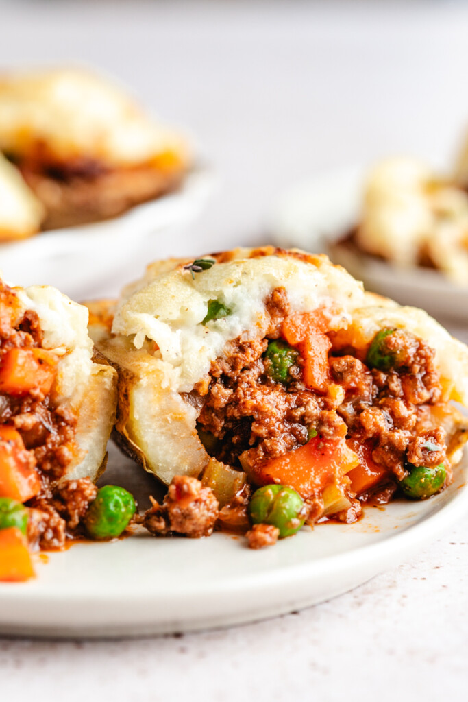 A close up of a A Shepherd's Pie Stuffed Potato cut in half
