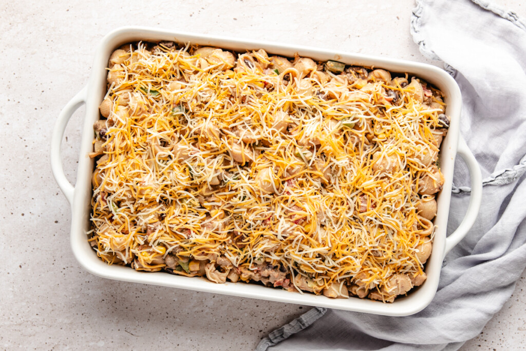 unbaked southwest cheesy pasta bake in a white casserole dish