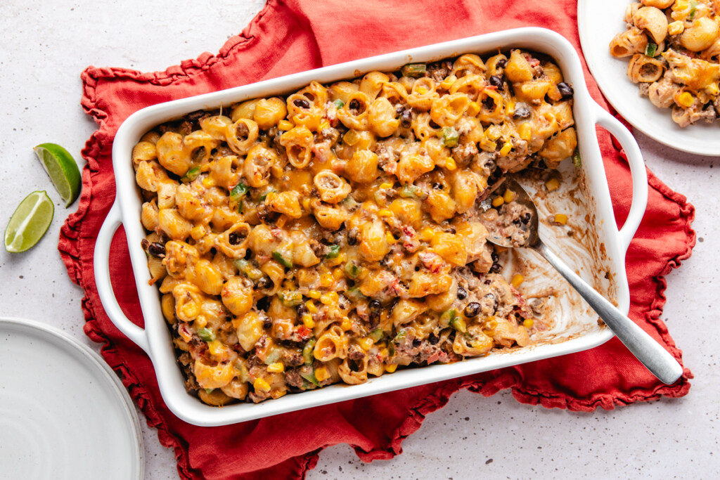 cheesy pasta bake in a white casserole dish